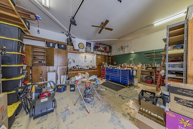garage with a ceiling fan and a workshop area