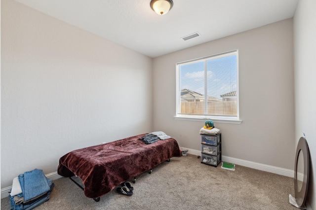 bedroom featuring baseboards, visible vents, and carpet floors