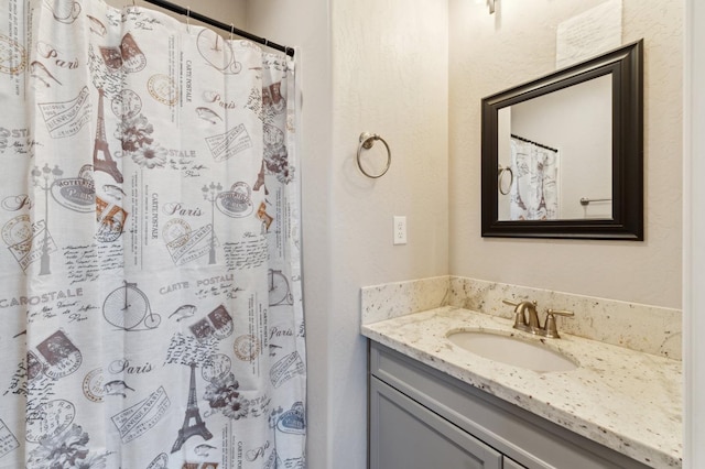 full bath with vanity and a shower with curtain