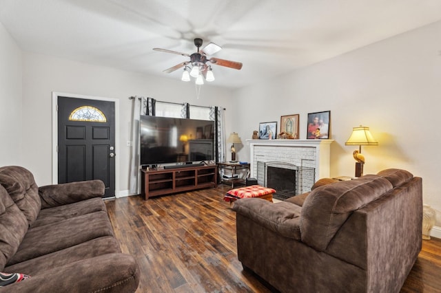 3154 E Montecito Ave, Fresno, CA 93702 - living area with a ceiling fan, dark wood-style flooring, and a fireplace