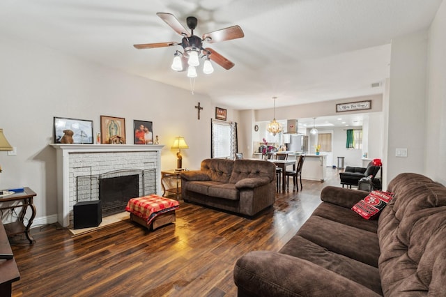 3154 E Montecito Ave, Fresno, CA 93702 - living room with a ceiling fan, wood finished floors, and a brick fireplace