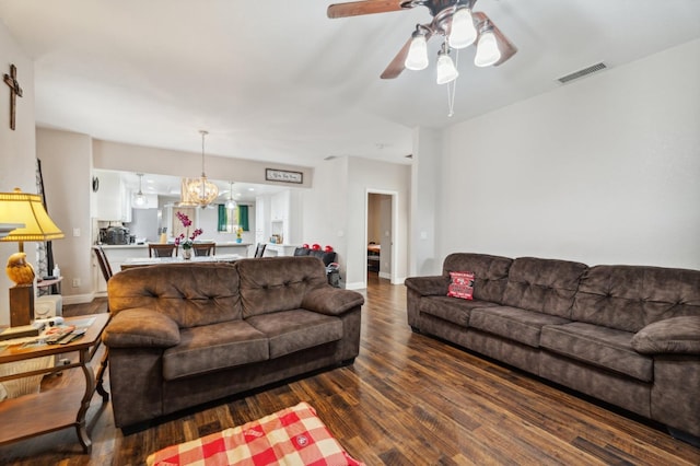 3154 E Montecito Ave, Fresno, CA 93702 - living area featuring wood finished floors, a ceiling fan, and a chandelier