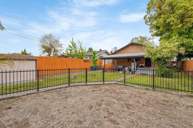 3154 E Montecito Ave, Fresno, CA 93702 - fenced backyard featuring an outbuilding and a patio area