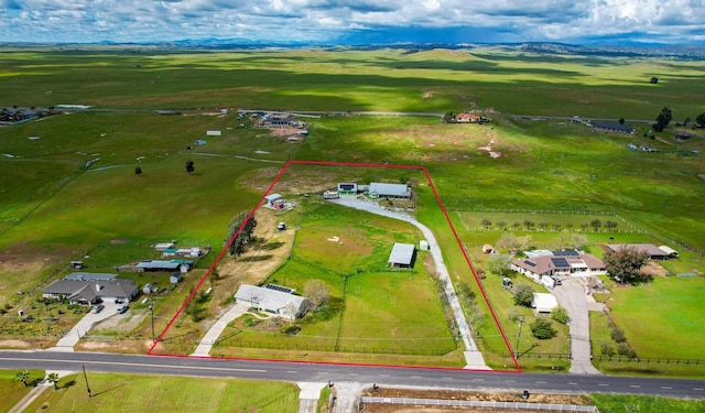 birds eye view of property with a rural view