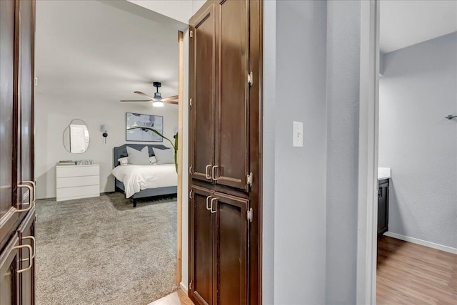 bedroom with a ceiling fan and baseboards