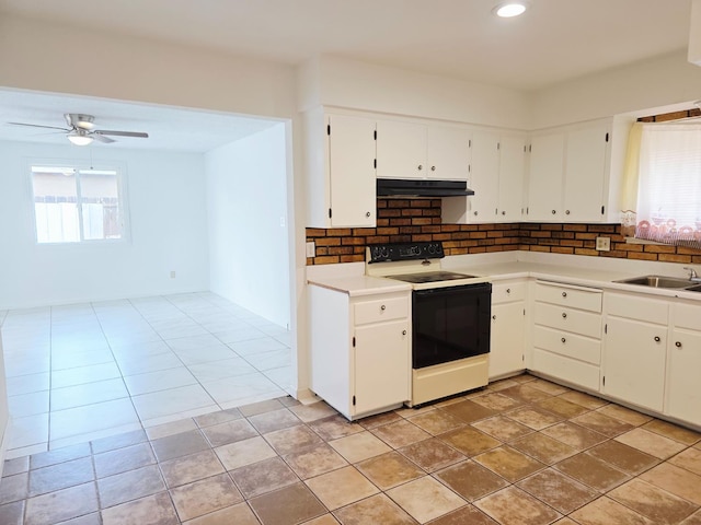 4571 N Kavanagh Ave, Fresno, CA 93705 - kitchen featuring range with electric cooktop, under cabinet range hood, tasteful backsplash, light countertops, and a ceiling fan
