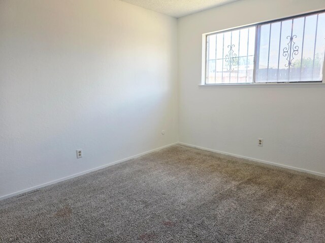 4571 N Kavanagh Ave, Fresno, CA 93705 - carpeted spare room featuring baseboards