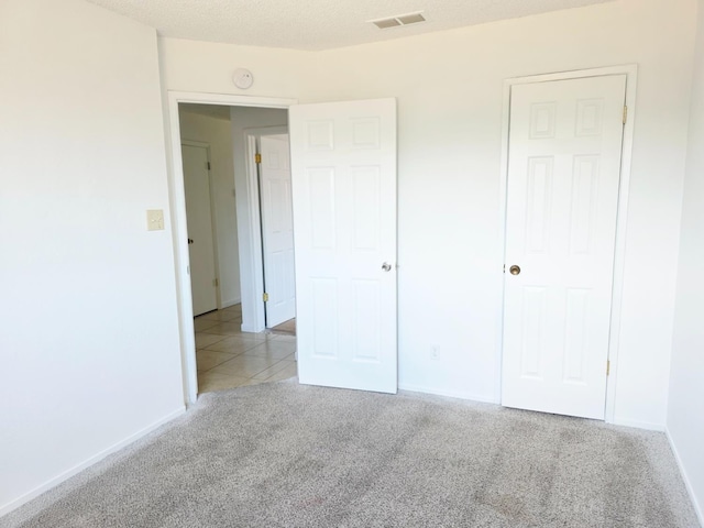 4571 N Kavanagh Ave, Fresno, CA 93705 - unfurnished bedroom featuring carpet floors and baseboards
