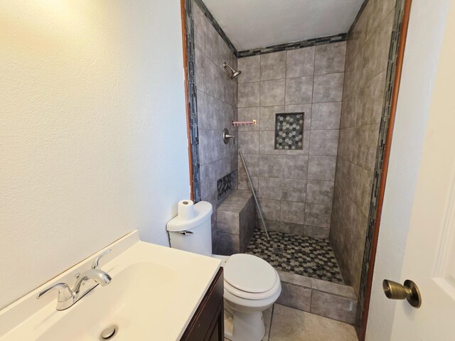 4571 N Kavanagh Ave, Fresno, CA 93705 - full bath with toilet, tiled shower, and vanity