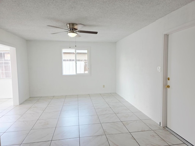 4571 N Kavanagh Ave, Fresno, CA 93705 - spare room featuring ceiling fan and a textured ceiling