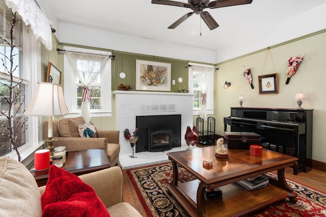 living room with wood finished floors and a ceiling fan