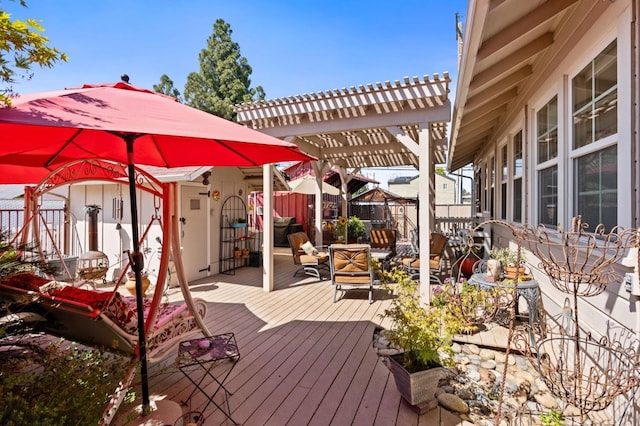 wooden deck with a pergola and fence