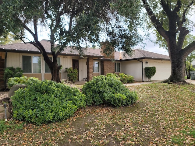 ranch-style house featuring an attached garage