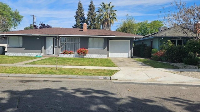 1206 W Harvard Ave, Fresno, CA 93705 - ranch-style house featuring a garage, a front lawn, concrete driveway, and stucco siding