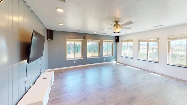 2299 N Garfield Ave, Fresno, CA 93723 - spare room with ceiling fan, a textured ceiling, light wood-style flooring, baseboards, and recessed lighting