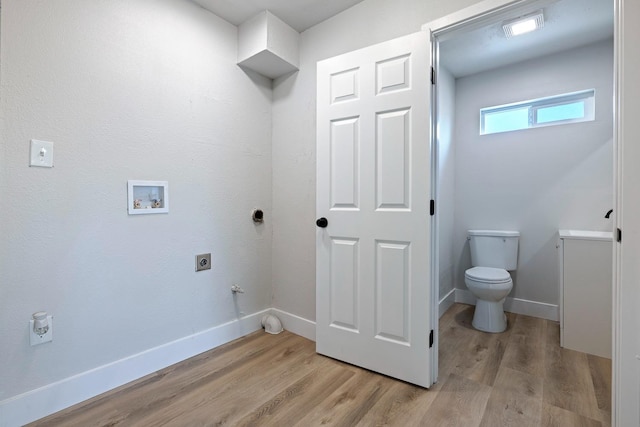 1633 W Saginaw Way, Fresno, CA 93705 - laundry room featuring hookup for an electric dryer, gas dryer hookup, light wood-style flooring, and hookup for a washing machine