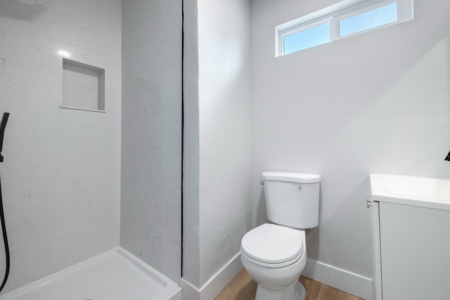 1633 W Saginaw Way, Fresno, CA 93705 - full bathroom with vanity, wood finished floors, and a shower