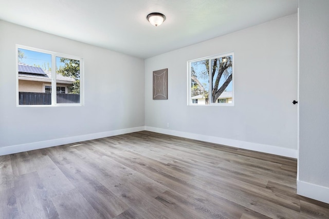 1633 W Saginaw Way, Fresno, CA 93705 - empty room featuring wood finished floors and baseboards