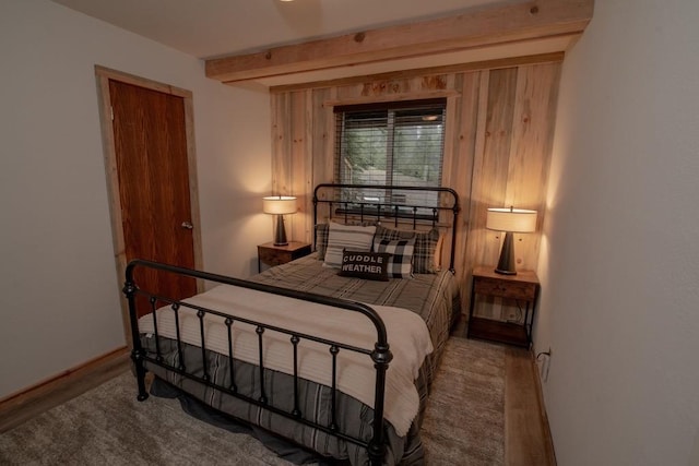 bedroom with beam ceiling