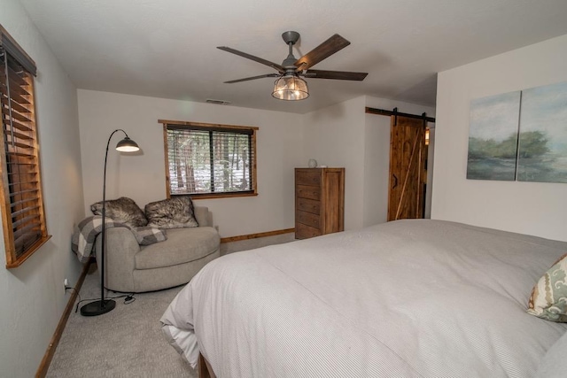 38660 Woodland Rd, Shaver Lake, CA 93664 - bedroom featuring a barn door, baseboards, carpet floors, and ceiling fan