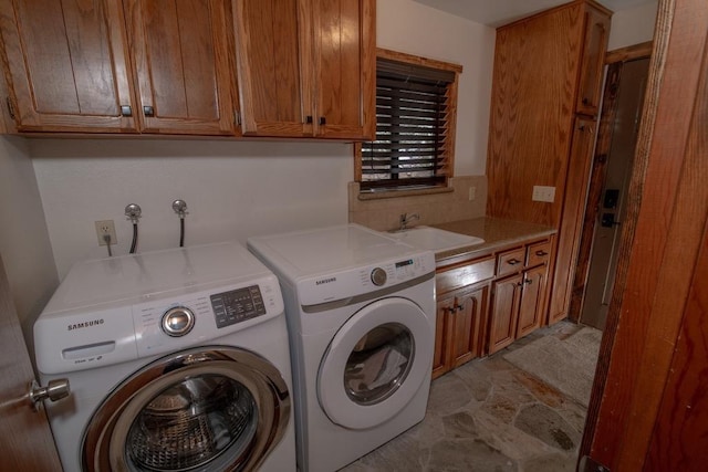 38660 Woodland Rd, Shaver Lake, CA 93664 - laundry area with cabinet space, independent washer and dryer, and light stone finish floors