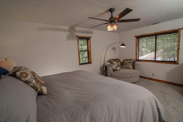 38660 Woodland Rd, Shaver Lake, CA 93664 - bedroom with light carpet, baseboards, and ceiling fan