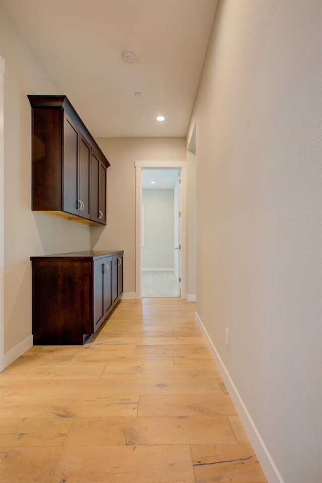 2791 E Tuolumne Rd, Turlock, CA 95382 - hallway with light wood finished floors, recessed lighting, and baseboards