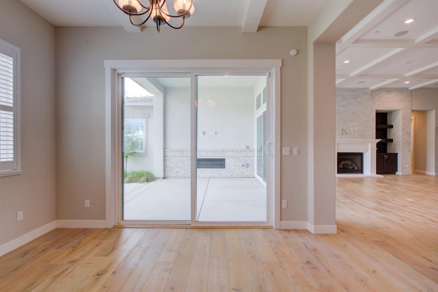 2791 E Tuolumne Rd, Turlock, CA 95382 - empty room with beam ceiling, a chandelier, light wood-style flooring, baseboards, and recessed lighting
