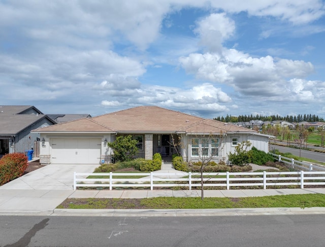 2791 E Tuolumne Rd, Turlock, CA 95382 - ranch-style house featuring a fenced front yard, concrete driveway, an attached garage, and stucco siding