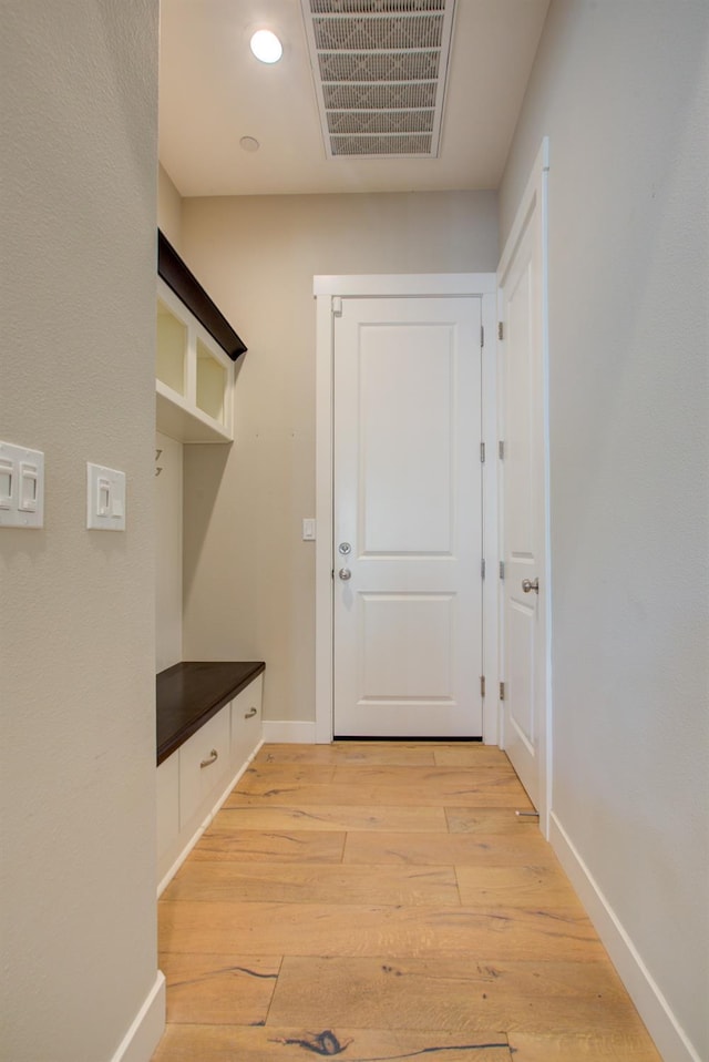 2791 E Tuolumne Rd, Turlock, CA 95382 - mudroom with light wood-style floors, baseboards, and recessed lighting