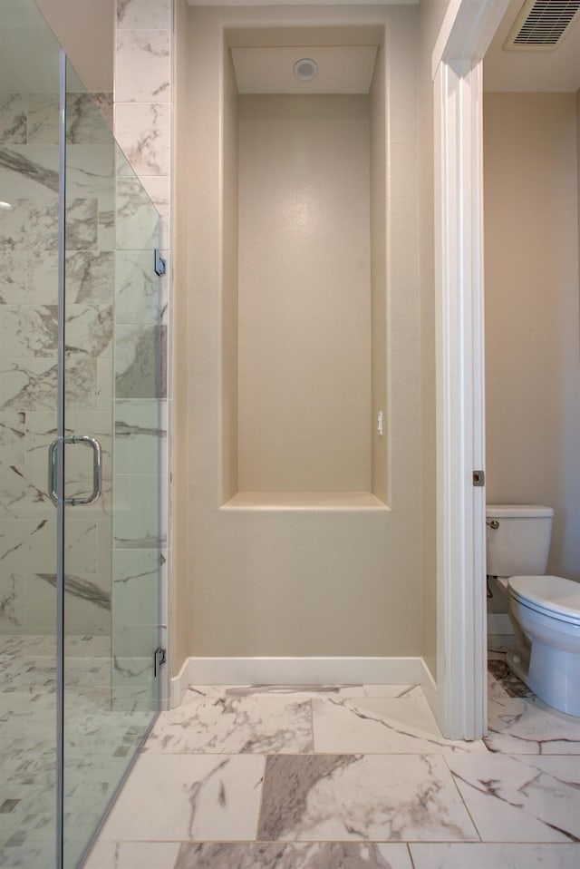 2791 E Tuolumne Rd, Turlock, CA 95382 - full bathroom with a marble finish shower, toilet, baseboards, and marble finish floors