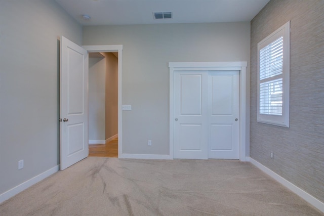 2791 E Tuolumne Rd, Turlock, CA 95382 - unfurnished bedroom featuring baseboards, carpet flooring, and a closet