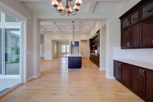 2791 E Tuolumne Rd, Turlock, CA 95382 - kitchen featuring coffered ceiling, light wood-type flooring, beamed ceiling, light countertops, and a chandelier
