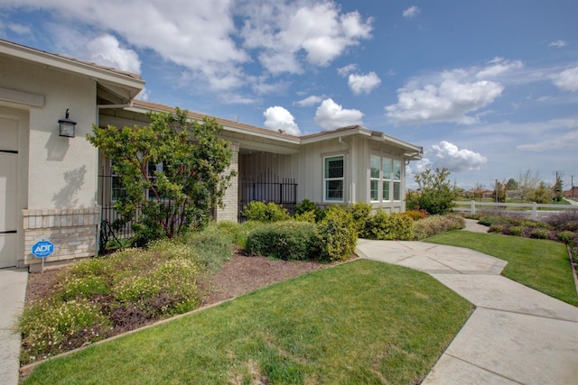2791 E Tuolumne Rd, Turlock, CA 95382 - view of exterior entry with board and batten siding
