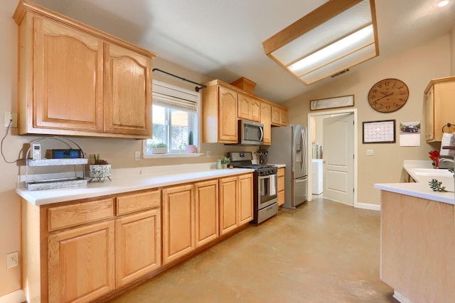 kitchen with light countertops, visible vents, stainless steel appliances, lofted ceiling, and light brown cabinetry