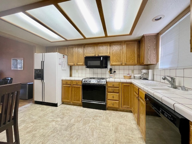 40547 Saddleback Rd, Bass Lake, CA 93604 - kitchen with tasteful backsplash, tile countertops, a sink, black appliances, and brown cabinetry