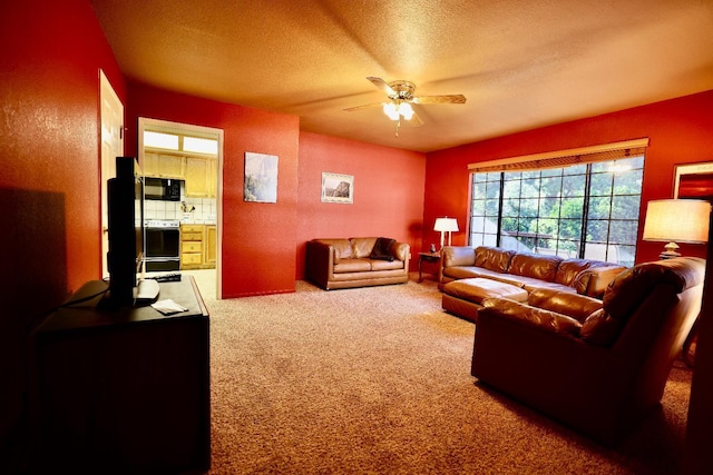 40547 Saddleback Rd, Bass Lake, CA 93604 - living room featuring carpet floors, a textured ceiling, and a ceiling fan