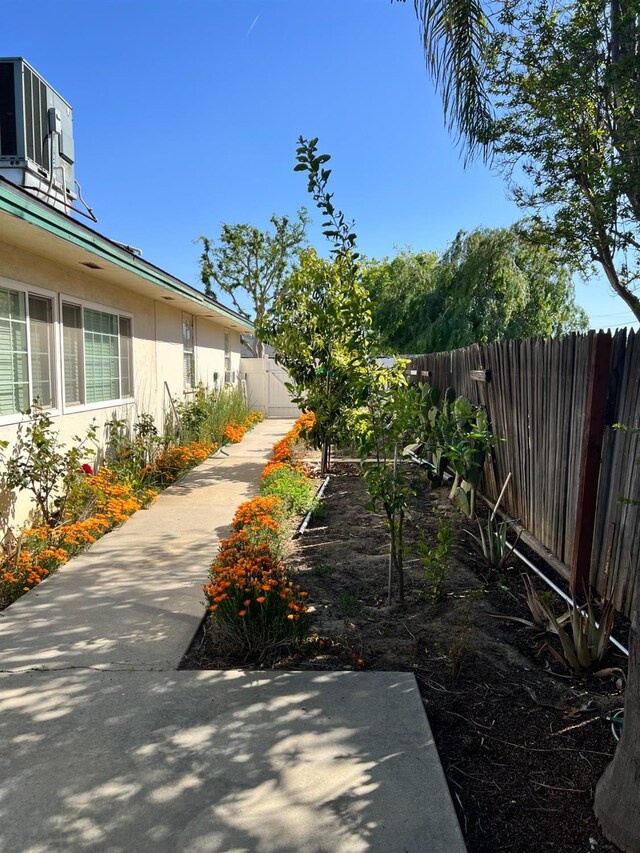 2040 Cypress St, Selma, CA 93662 - view of yard featuring a fenced backyard and central AC unit