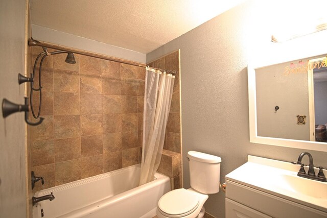 16935 Mark Rd, Madera, CA 93636 - full bathroom featuring shower / bathtub combination with curtain, vanity, toilet, a textured wall, and a textured ceiling