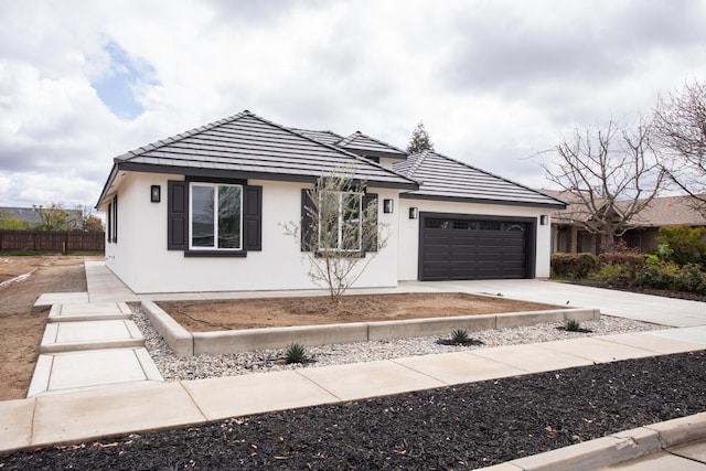 590 Lincoln Ave Unit 101, Dinuba, CA 93618 - ranch-style home featuring a tile roof, stucco siding, a garage, and concrete driveway