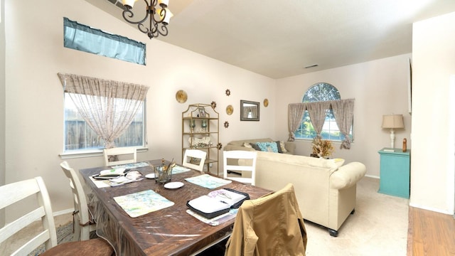 218 Casa Buena Ln, Coalinga, CA 93210 - dining space with baseboards, a notable chandelier, and light wood-style flooring