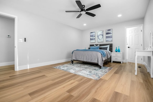bedroom featuring light wood-type flooring, baseboards, a ceiling fan, and recessed lighting