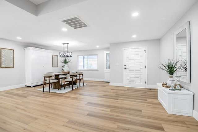 dining space with light wood-style floors, baseboards, visible vents, and recessed lighting