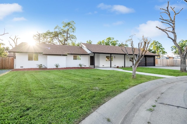 single story home featuring stucco siding, driveway, an attached garage, a front lawn, and fence