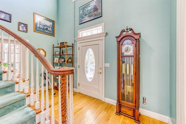 49521 Stillmeadow Dr, Oakhurst, CA 93644 - foyer with stairway, a towering ceiling, baseboards, and light wood finished floors