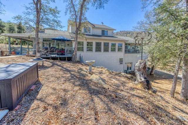 49521 Stillmeadow Dr, Oakhurst, CA 93644 - back of house featuring a carport, a wooden deck, and roof with shingles