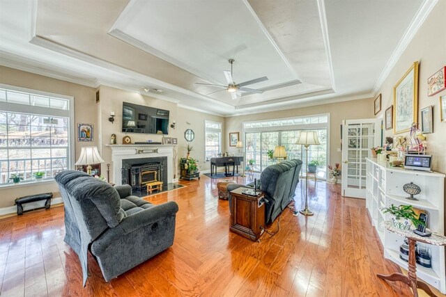 49521 Stillmeadow Dr, Oakhurst, CA 93644 - living room with a raised ceiling, light wood-type flooring, crown molding, and a ceiling fan