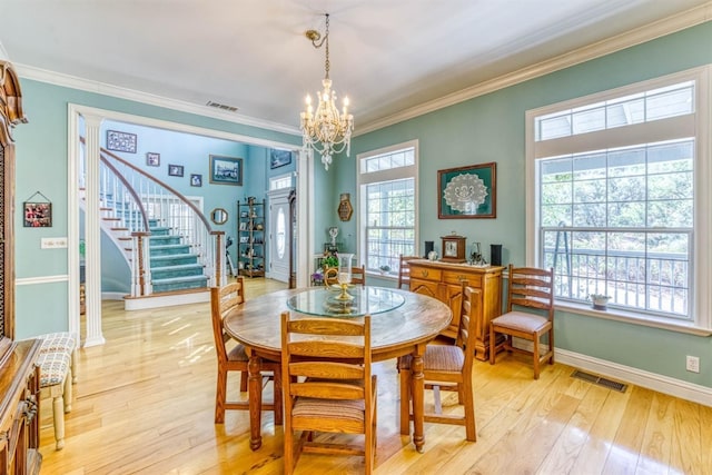 49521 Stillmeadow Dr, Oakhurst, CA 93644 - dining room featuring light wood finished floors, an inviting chandelier, visible vents, and stairway