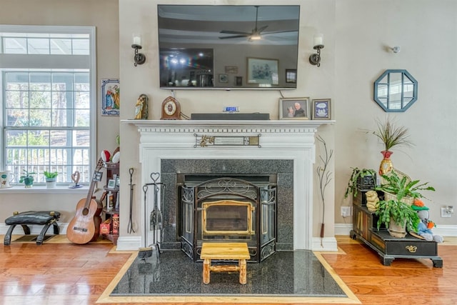 49521 Stillmeadow Dr, Oakhurst, CA 93644 - details with baseboards, a ceiling fan, and wood finished floors