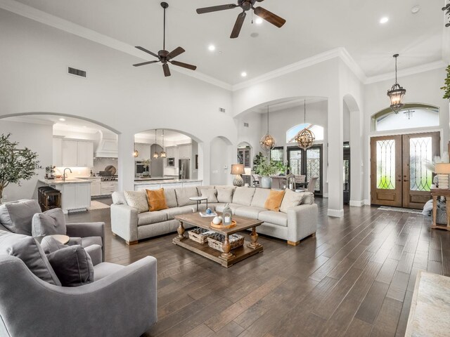 2567 E Sarazen, Fresno, CA 93730 - living area with high vaulted ceiling, a ceiling fan, recessed lighting, arched walkways, and dark wood finished floors